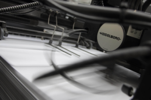 Industrial-grade printing and binding equipment allows professional printing companies to create multiple copies in a row